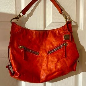 GUC shoulder bag ostrich leather has interior paint inside.
